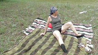 Skillful German granny making a young dude happy in the field